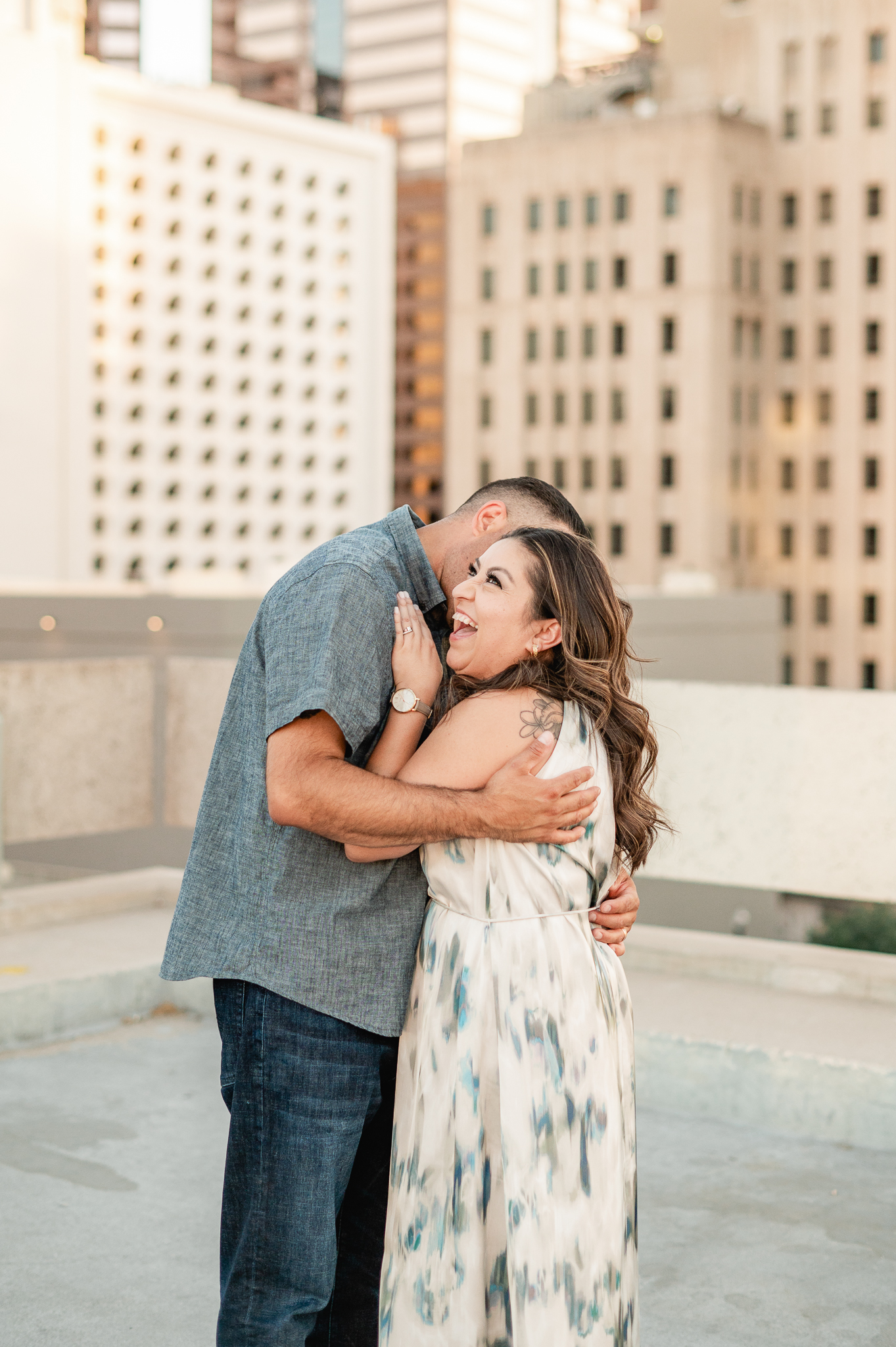 couple embracing on top of a parking garage at sunset in downtown phoenix 