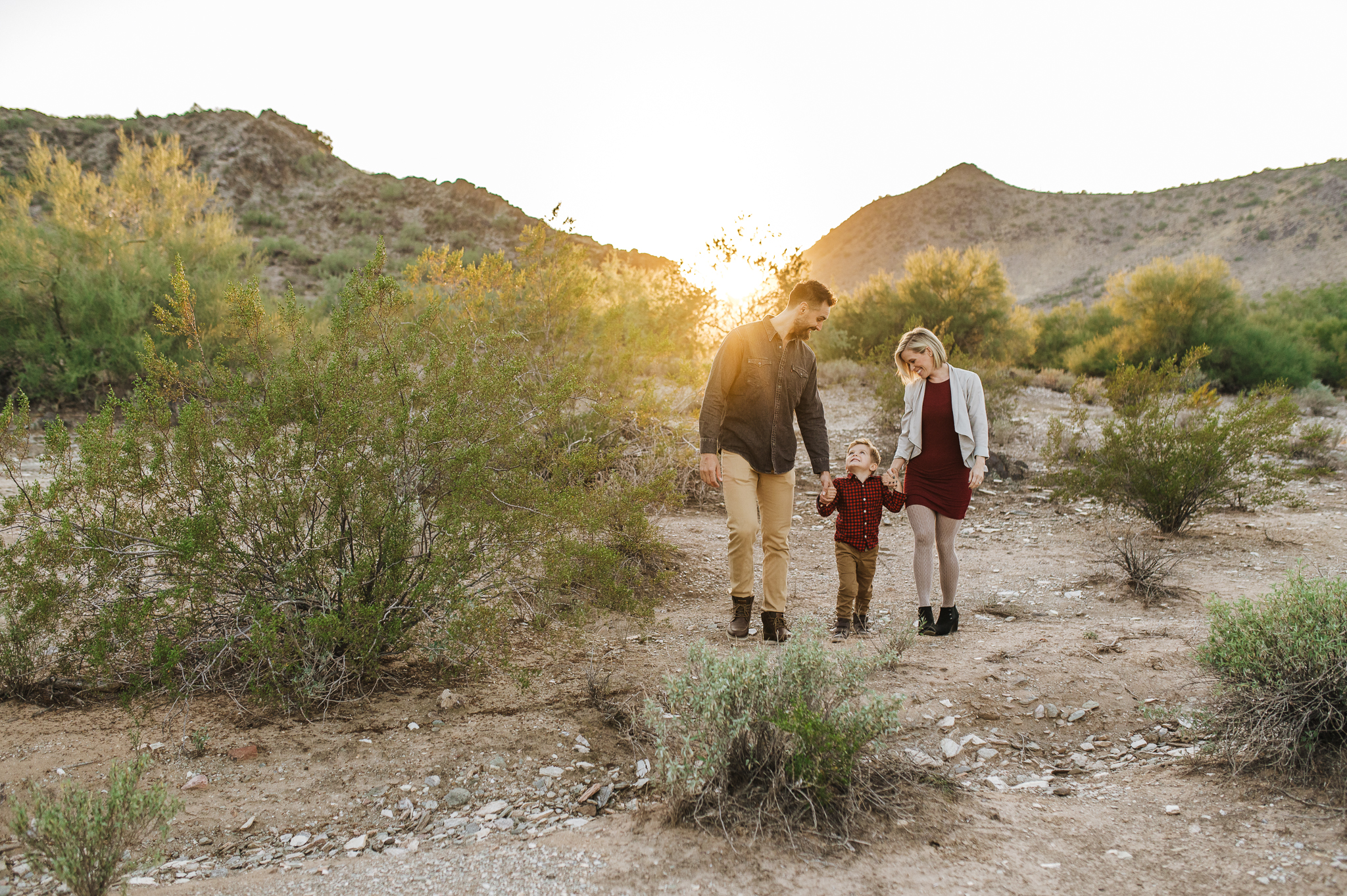 family of three amidst the Scottsdale desert on their staycation