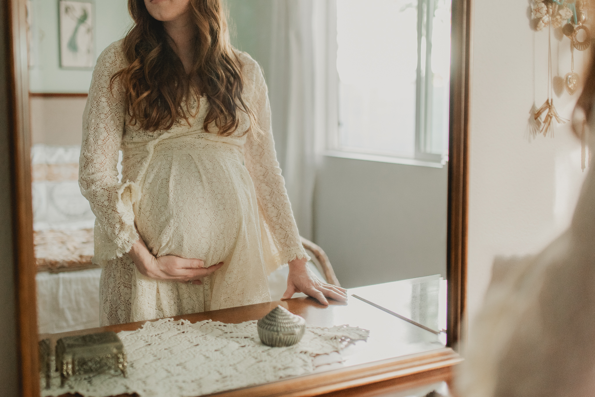 pregnant mom in Phoenix holding her belly, ready for her homebirth with Crystal Pena